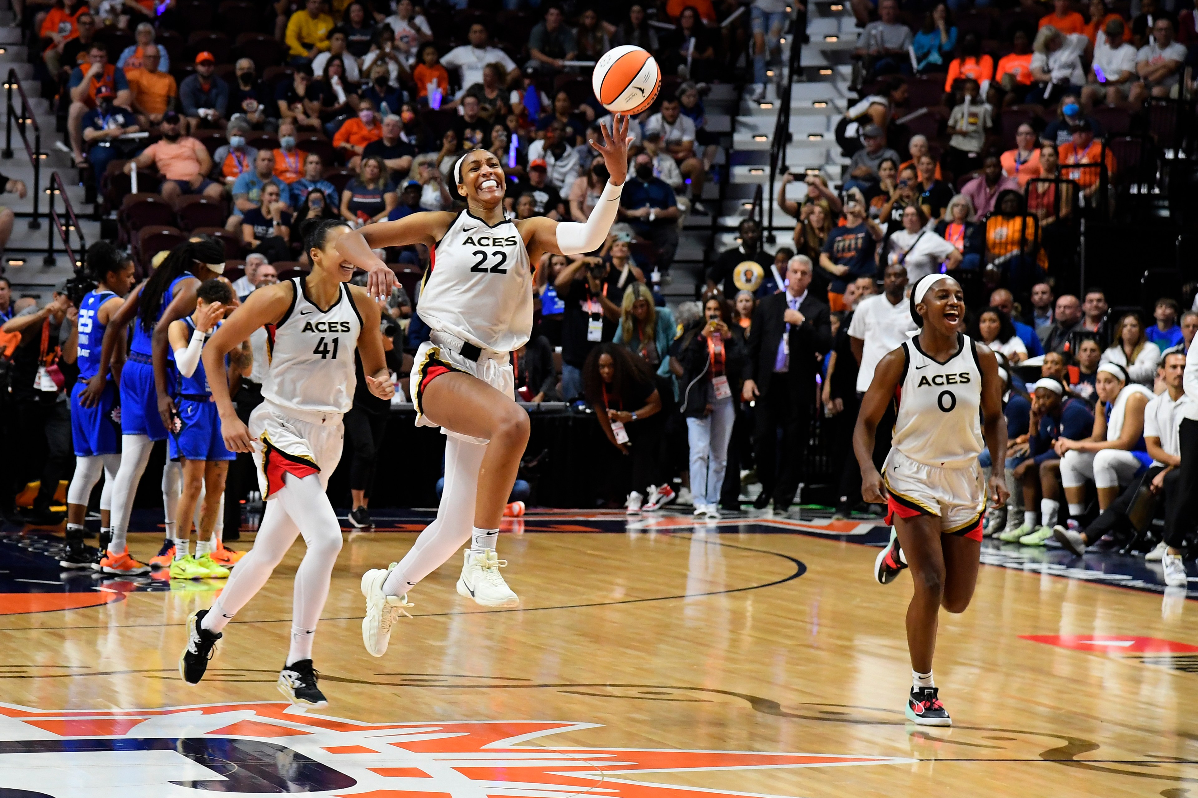 The Las Vegas Aces celebrate after Game 4 of the 2022 WNBA Finals on September 18, 2022 at Mohegan Sun Arena in Uncasville, Connecticut.