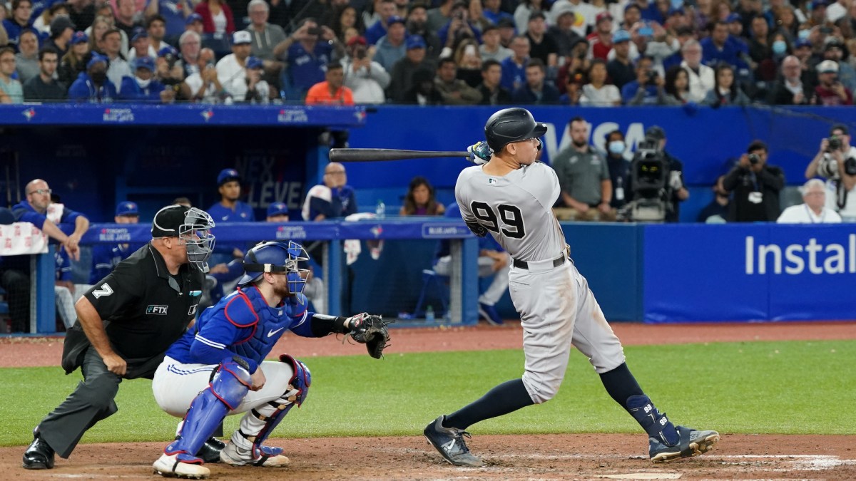 TORONTO, - SEPTEMBER 28: Aaron Judge #99 of the New York Yankees hits a home run in the seventh inning and tying Roger Maris AL record for most home runs in a single season during the game between the New York Yankees and the Toronto Blue Jays at Rogers Centre on Wednesday, September 28, 2022 in Toronto, Canada. (Photo by Thomas Skrlj/MLB Photos via Getty Images)