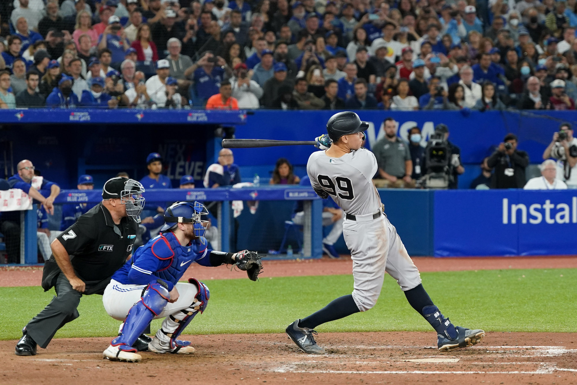 TORONTO, - SEPTEMBER 28: Aaron Judge #99 of the New York Yankees hits a home run in the seventh inning and tying Roger Maris AL record for most home runs in a single season during the game between the New York Yankees and the Toronto Blue Jays at Rogers Centre on Wednesday, September 28, 2022 in Toronto, Canada. (Photo by Thomas Skrlj/MLB Photos via Getty Images)
