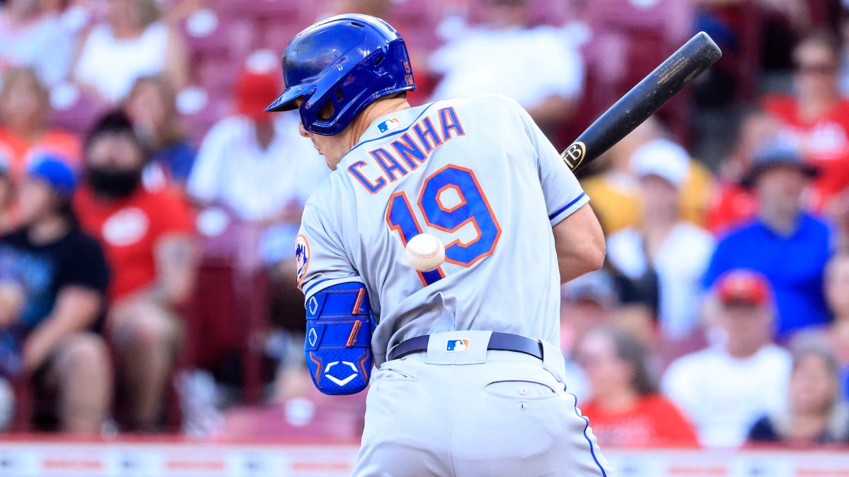 CINCINNATI, OHIO - JULY 04: Mark Canha #19 of the New York Mets is hit by a pitch in the second inning against the Cincinnati Reds at Great American Ball Park on July 04, 2022 in Cincinnati, Ohio. (Photo by Justin Casterline/Getty Images)
