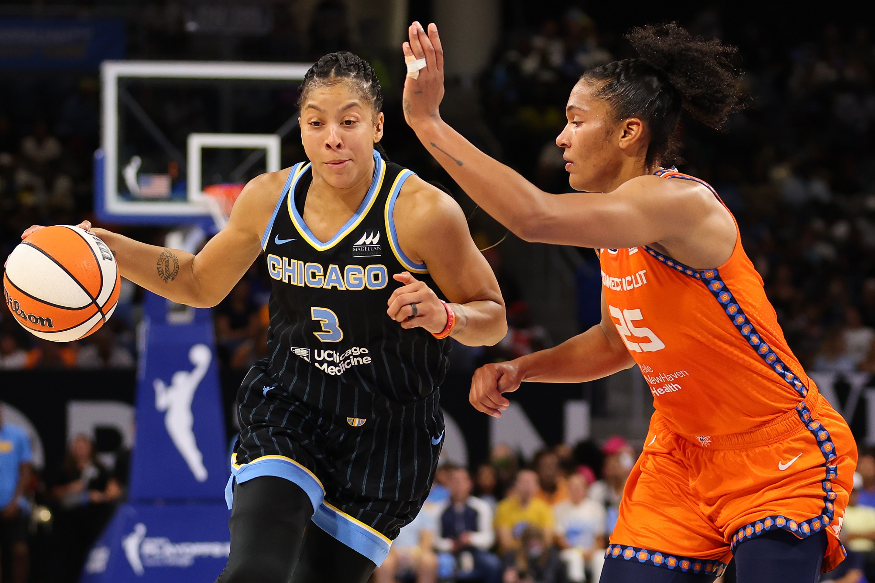 CHICAGO, ILLINOIS - AUGUST 31: Candace Parker #3 of the Chicago Sky drives to the basket against Alyssa Thomas #25 of the Connecticut Sun during the first half in Game Two of the 2022 WNBA Playoffs semifinals at Wintrust Arena on August 31, 2022 in Chicago, Illinois.