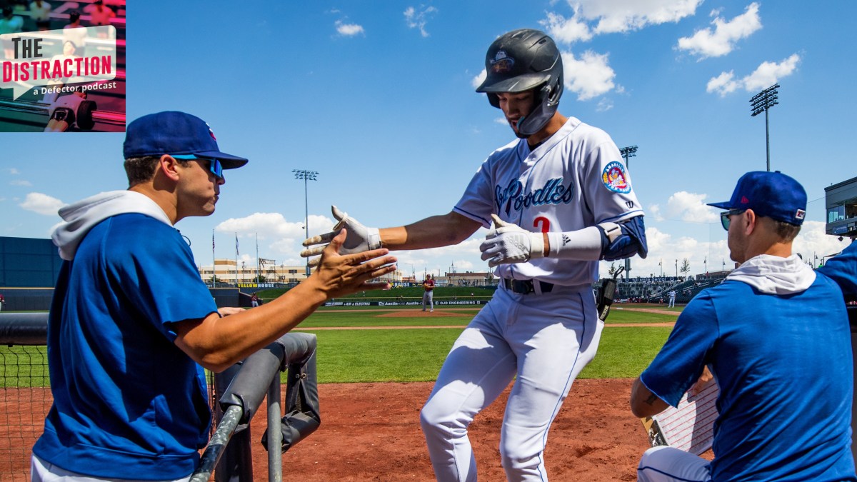 Amarillo Sod Poodles infielder Jordan Lawlar is congratulated by his coach after scoring a run in minor league game in 2022.