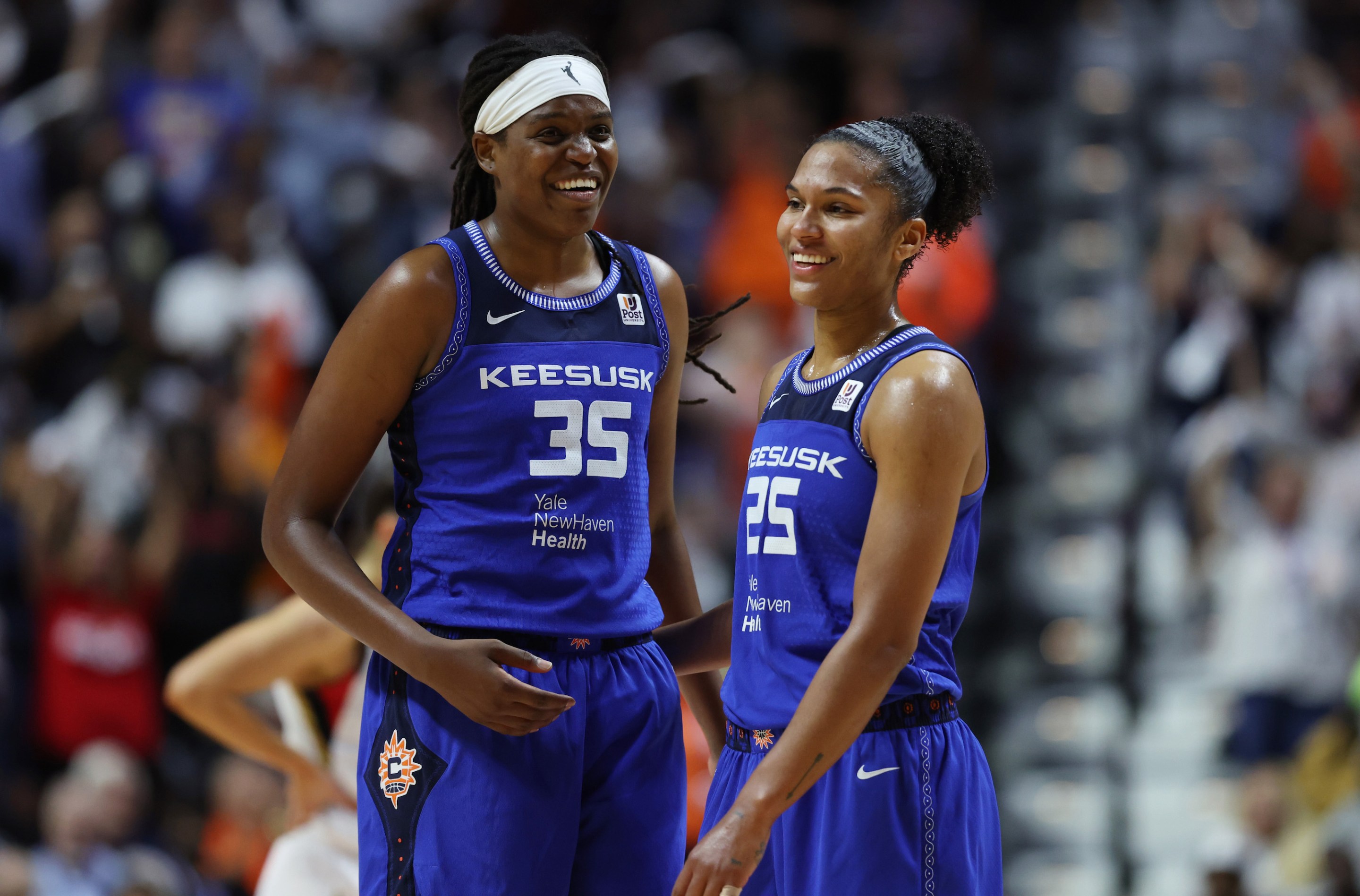Alyssa Thomas #25 of the Connecticut Sun is congratulated by teammate Jonquel Jones #35 as she is removed from the game in the fourth quarter against the Las Vegas Aces during Game Three of the 2022 WNBA Finals at Mohegan Sun Arena on September 15, 2022 in Uncasville, Connecticut