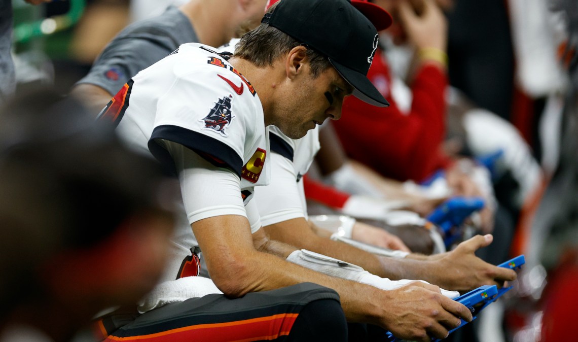 NEW ORLEANS, LOUISIANA - SEPTEMBER 18: Tom Brady #12 of the Tampa Bay Buccaneers looks at a tablet during the game against the New Orleans Saints at Caesars Superdome on September 18, 2022 in New Orleans, Louisiana. (Photo by Chris Graythen/Getty Images)