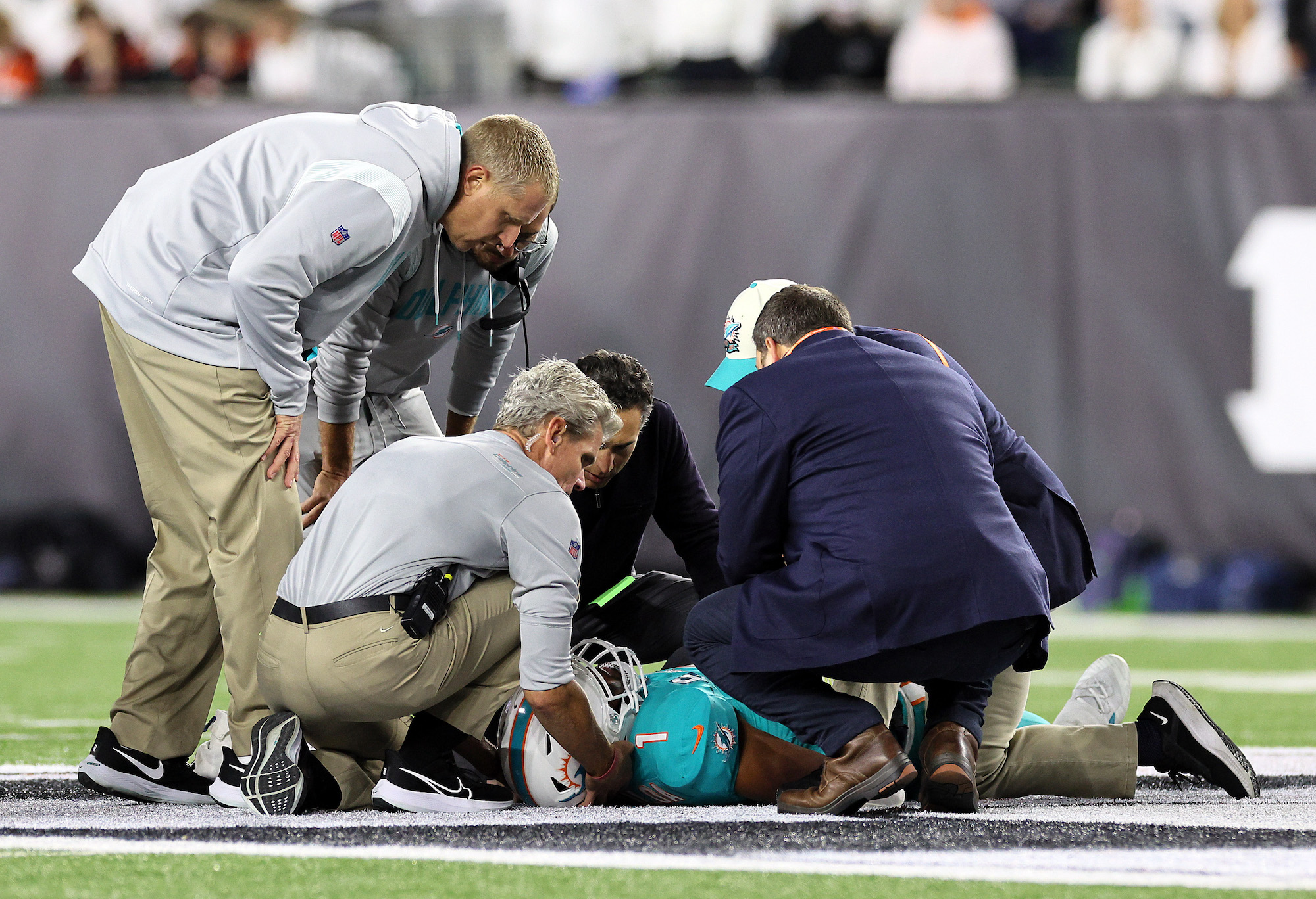 CINCINNATI, OHIO - SEPTEMBER 29: Medical staff tend to quarterback Tua Tagovailoa #1 of the Miami Dolphins after an injury during the 2nd quarter of the game against the Cincinnati Bengals at Paycor Stadium on September 29, 2022 in Cincinnati, Ohio. (Photo by Andy Lyons/Getty Images)