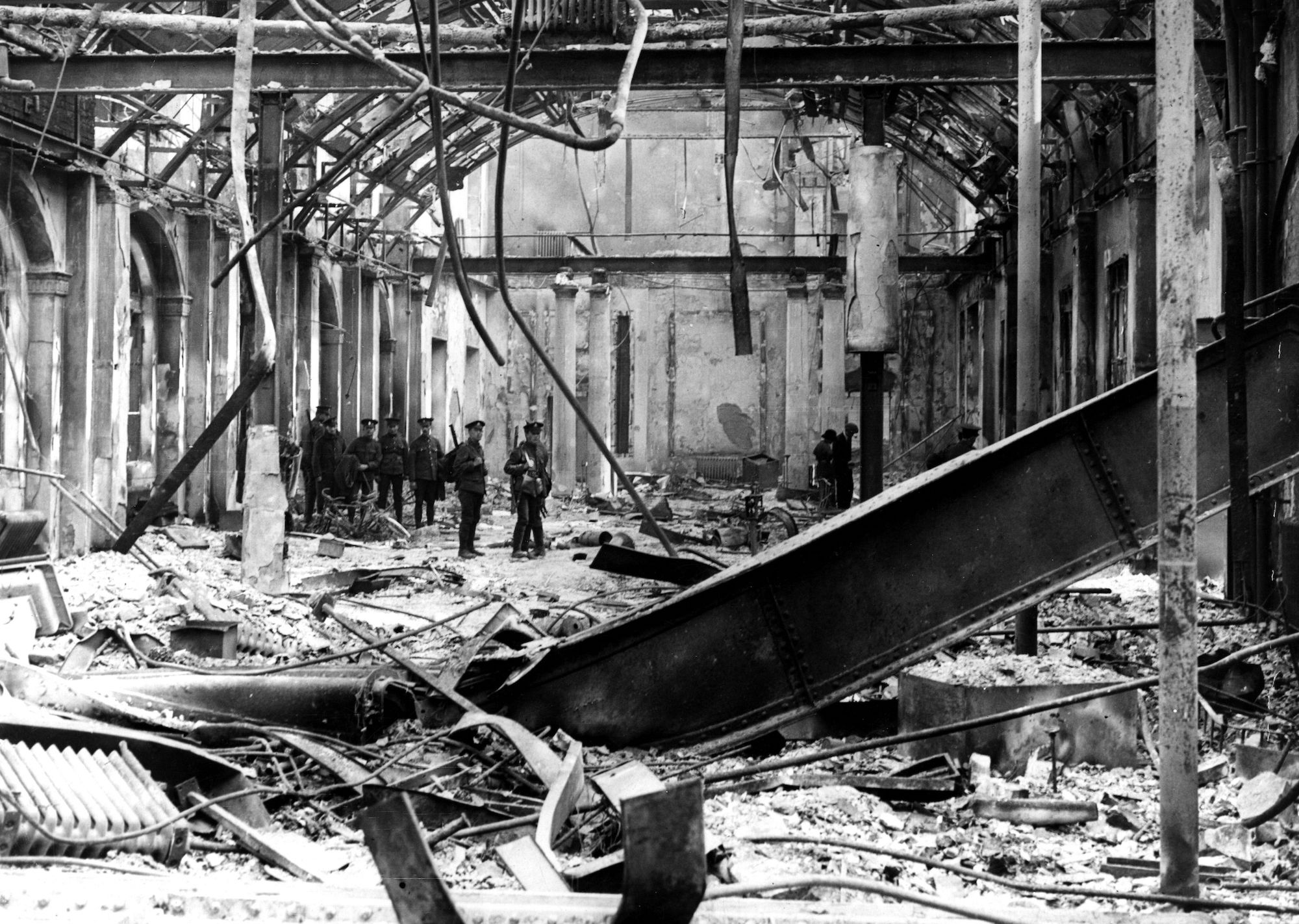1916: Soldiers survey the interior of the completely wrecked Post Office in Sackville Street, Dublin, during the Easter Rising of 1916. (Photo by Hulton Archive/Getty Images)