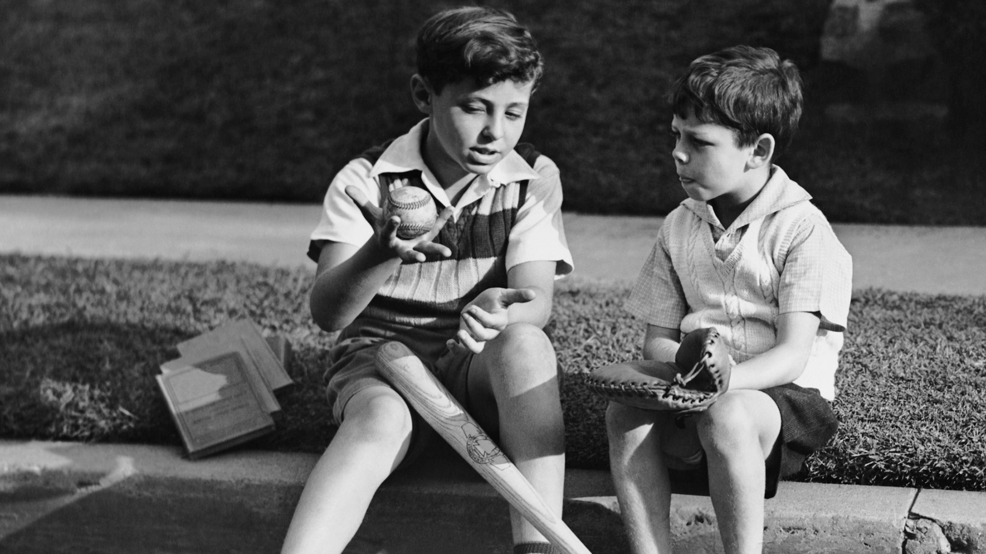 UNITED STATES - CIRCA 1950s: Two boys playing baseball.