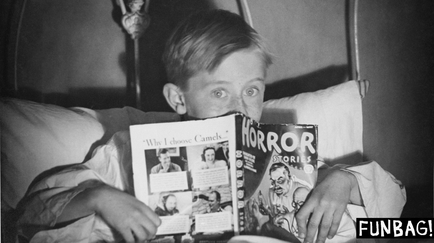 A boy in bed with a copy of 'Horror Stories' comic book, circa 1960. (Photo by Hunter/FPG/Hulton Archive/Getty Images)