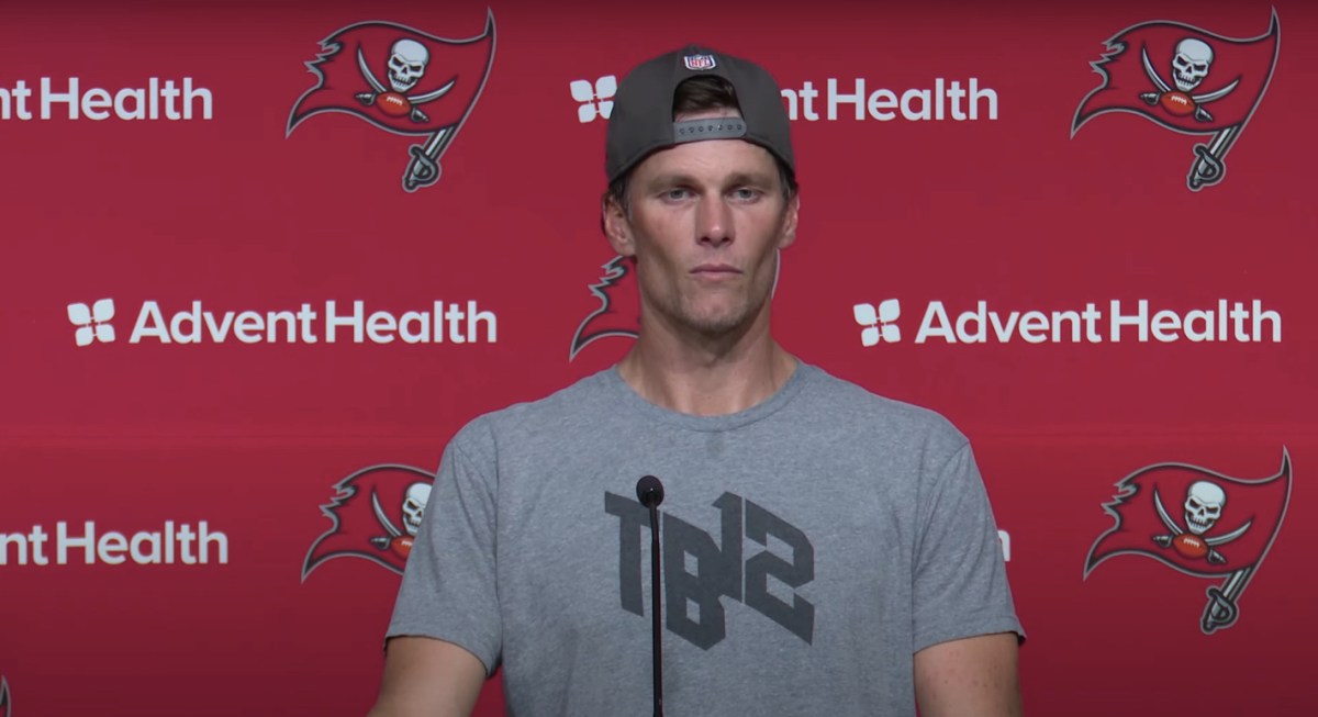 Tom Brady looking gaunt at a press conference.