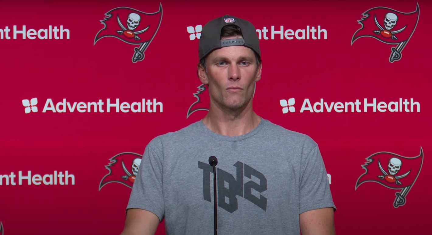 Tom Brady looking gaunt at a press conference.