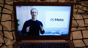 Mark Zuckerberg on a laptop screen with Meta logo