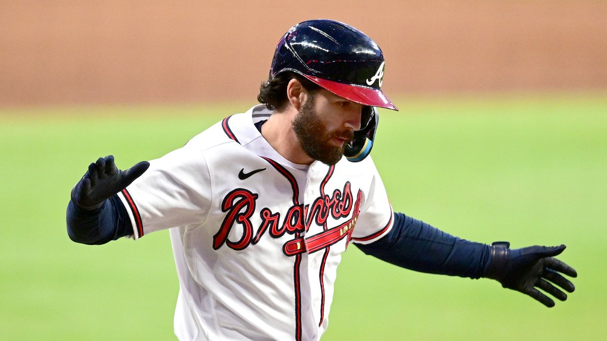 Dansby Swanson celebrates after hitting a home run