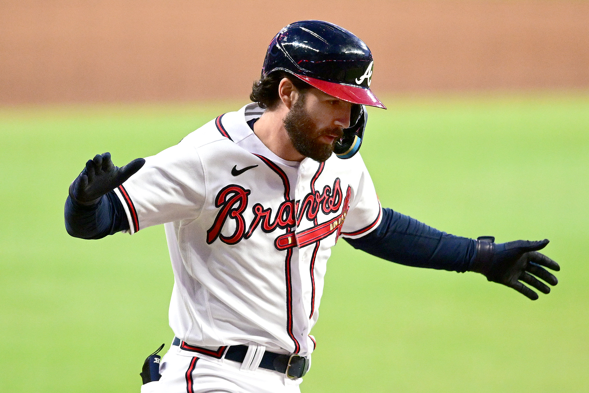 Dansby Swanson celebrates after hitting a home run