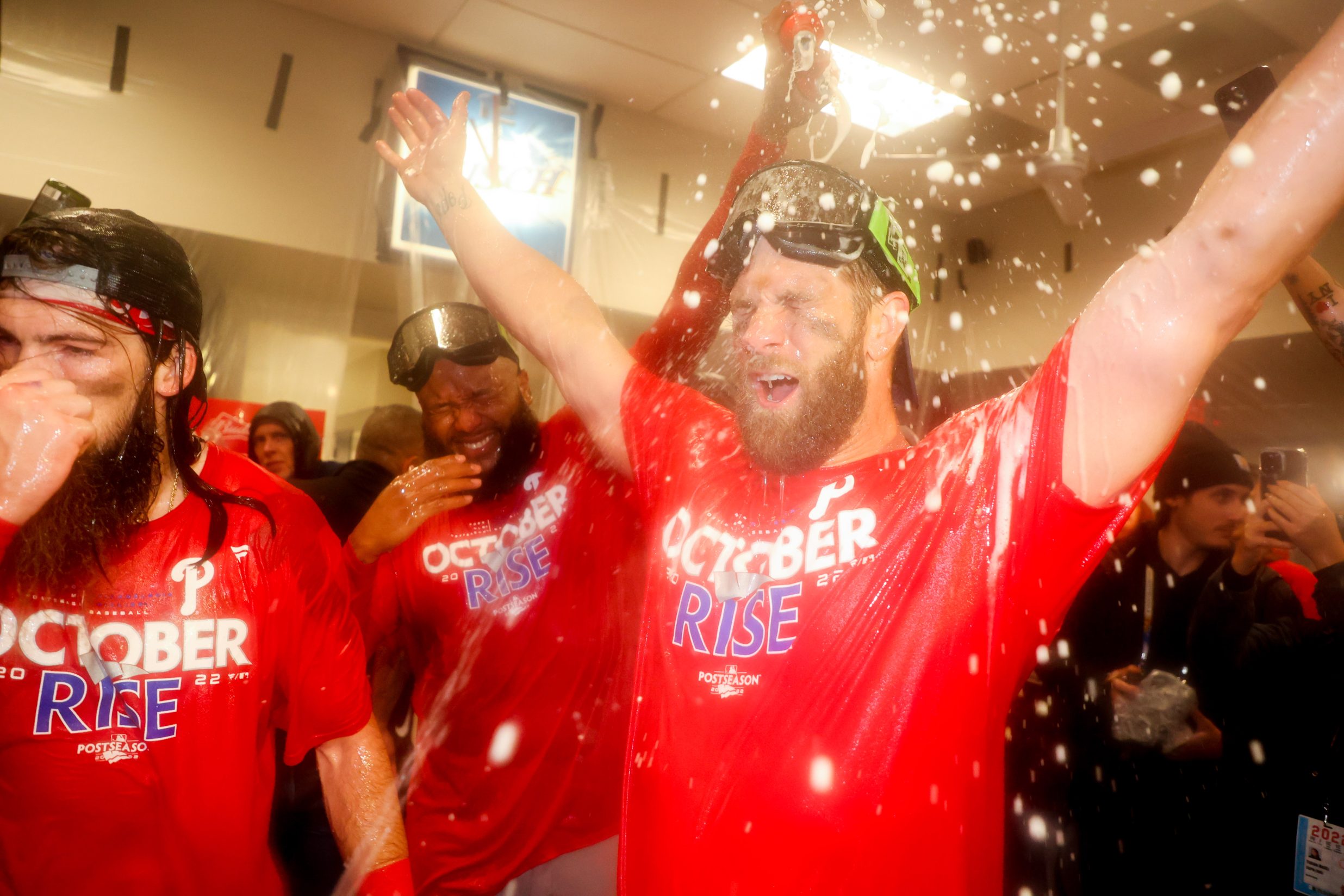 the Phillies celebrate in their locker room