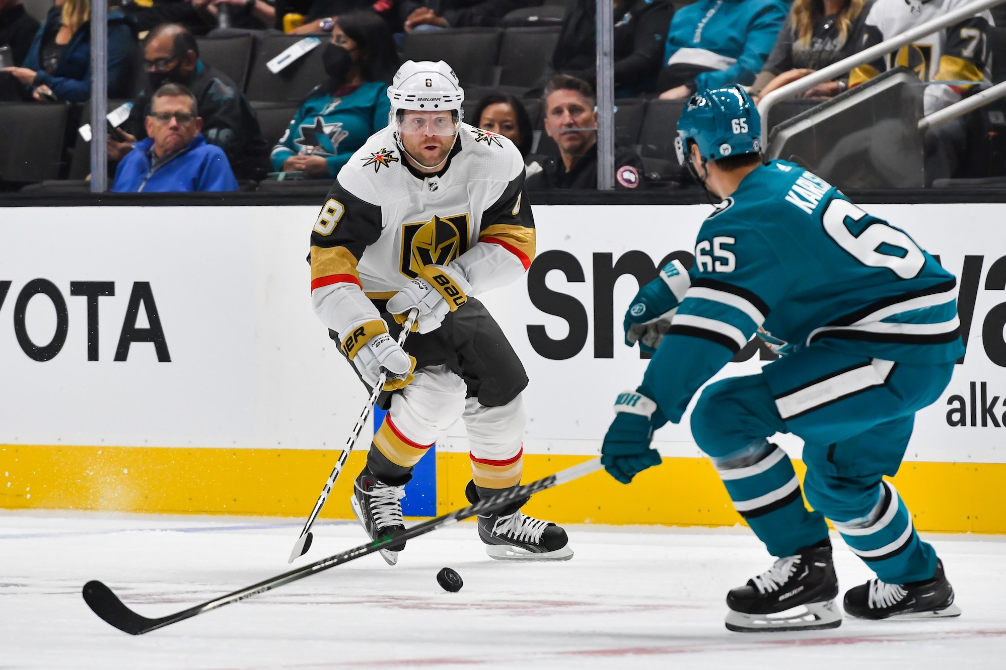 SAN JOSE, CA - OCTOBER 25:Vegas Golden Knights center Phil Kessel (8) goes after the puck against San Jose Sharks defenseman Erik Karlsson (65) while playing in his 990th consecutive game in the match between the Vegas Golden Knights and the San Jose Sharks on Tuesday, October 25, 2022 at the SAP Center in San Jose, California. (Photo by Douglas Stringer/Icon Sportswire via Getty Images)