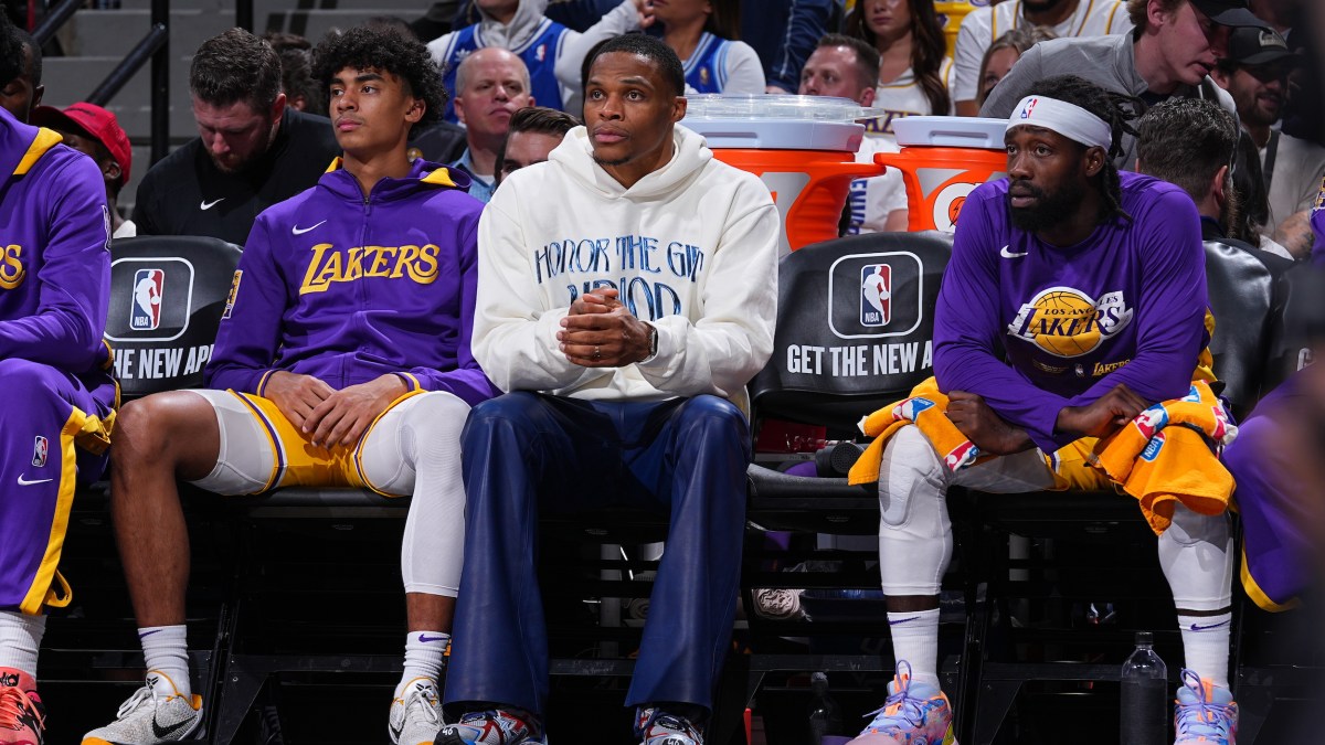 Russell Westbrook watches from the sidelines.