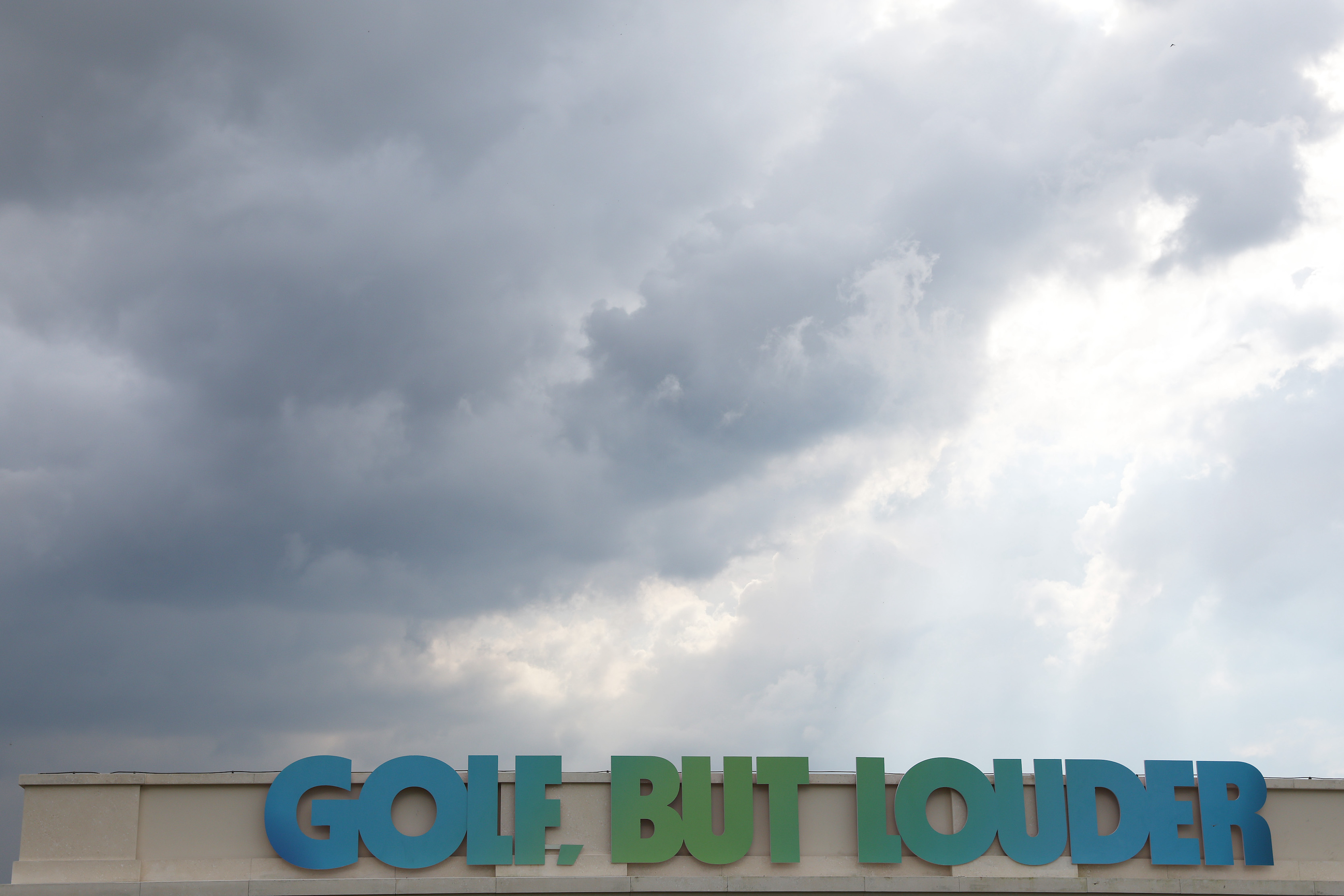 Ominous clouds over LIV Golf's slogan, "Golf, But Louder" at the tour's October event in Bangkok, Thailand.
