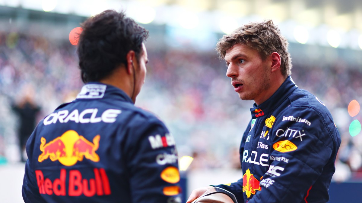 Race winner and 2022 F1 World Drivers Champion Max Verstappen of Netherlands and Oracle Red Bull Racing talks with Second placed Sergio Perez of Mexico and Oracle Red Bull Racing in parc ferme during the F1 Grand Prix of Japan at Suzuka International Racing Course on October 09, 2022 in Suzuka, Japan.