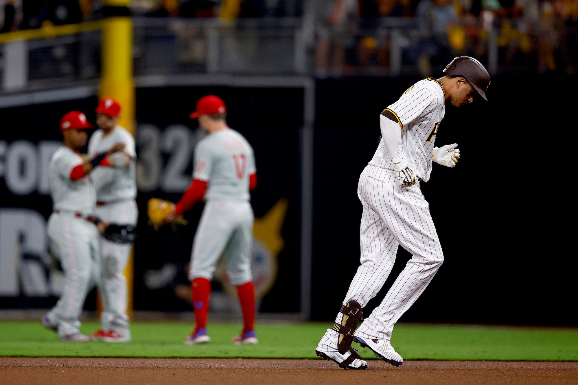 SAN DIEGO, CALIFORNIA - OCTOBER 18: Manny Machado #13 of the San Diego Padres reacts after flying out during the seventh inning against the Philadelphia Phillies in game one of the National League Championship Series at PETCO Park on October 18, 2022 in San Diego, California. (Photo by Ronald Martinez/Getty Images)