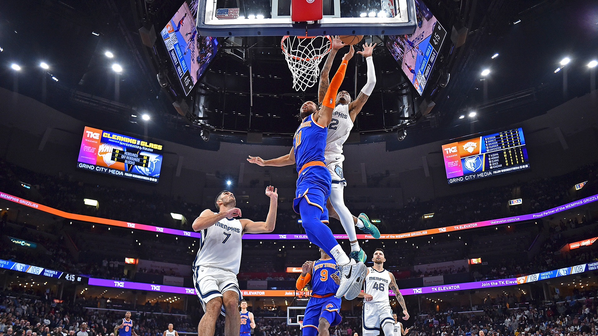 Jalen Brunson #11 of the New York Knicks goes to the basket against Ja Morant #12 of the Memphis Grizzlies during the game at FedExForum on October 19, 2022 in Memphis, Tennessee.