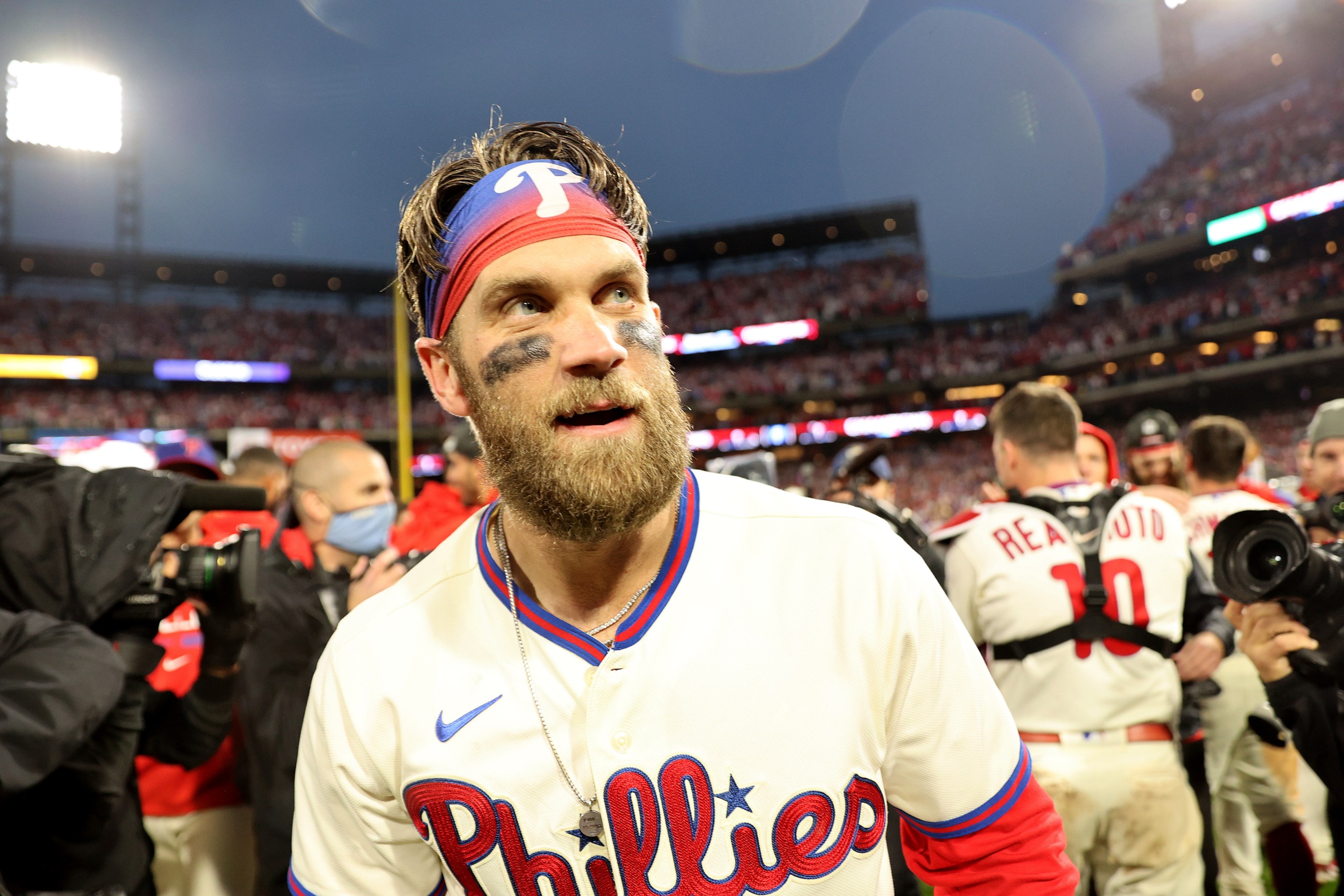 Bryce Harper on the field after the Phillies defeated the Padres in the 2022 National League Championship Series.