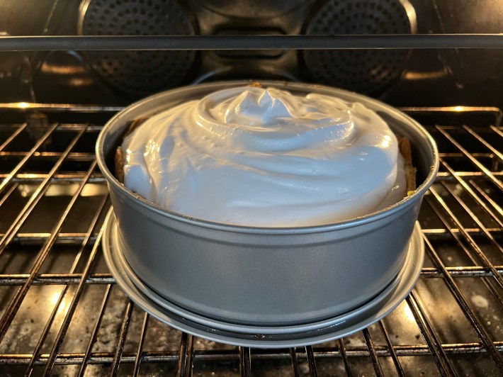 The pie goes back into the oven for the final bake.