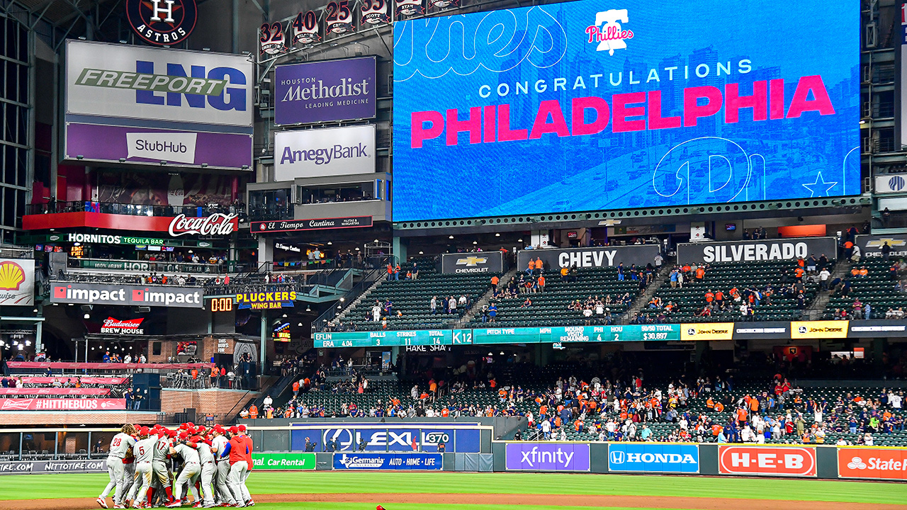 HOUSTON, TEXAS - OCTOBER 03: The Philadelphia Phillies celebrate after clinching the Wild Card, their first playoff berth since 2011 with a 3-0 win over the Houston Astros at Minute Maid Park on October 03, 2022 in Houston, Texas. (Photo by Logan Riely/Getty Images)