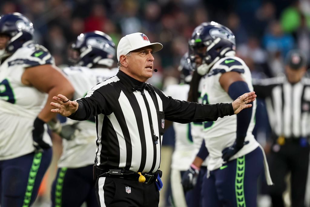 A referee gestures during an NFL game
