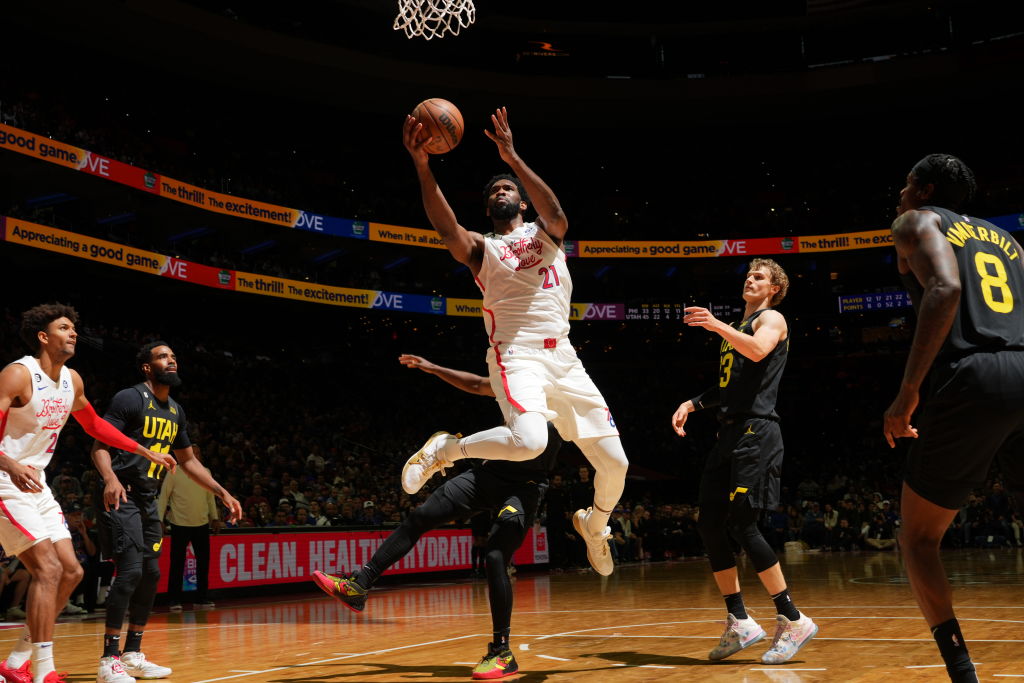 Joel Embiid attempts a lay-up in a career night.