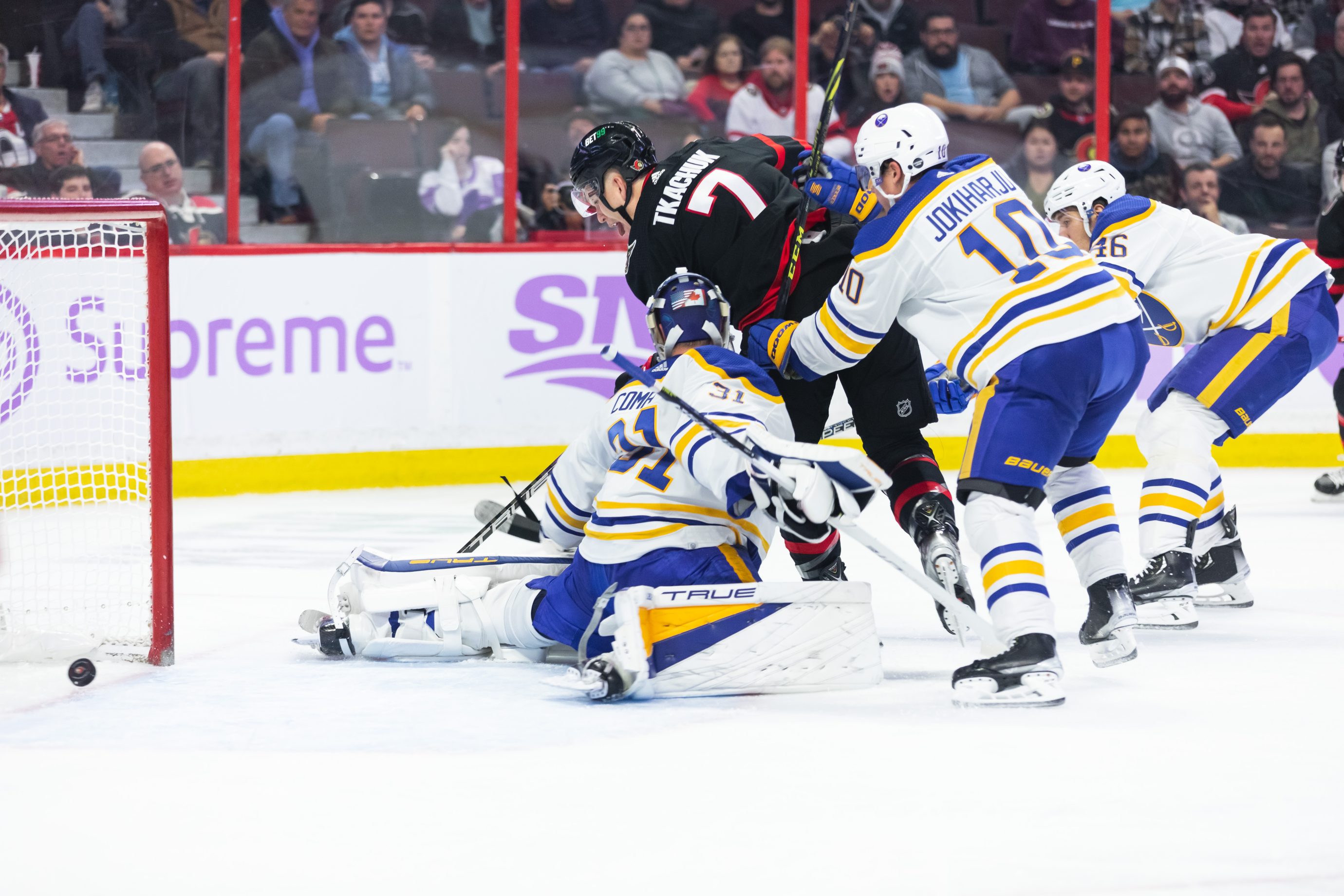 Brady Tkachuk backhands the puck for a goal