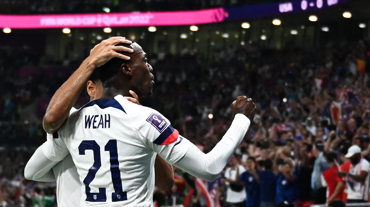 USA's forward #21 Timothy Weah celebrates after scoring his team's first goal during the Qatar 2022 World Cup Group B football match between USA and Wales at the Ahmad Bin Ali Stadium in Al-Rayyan, west of Doha on November 21, 2022.