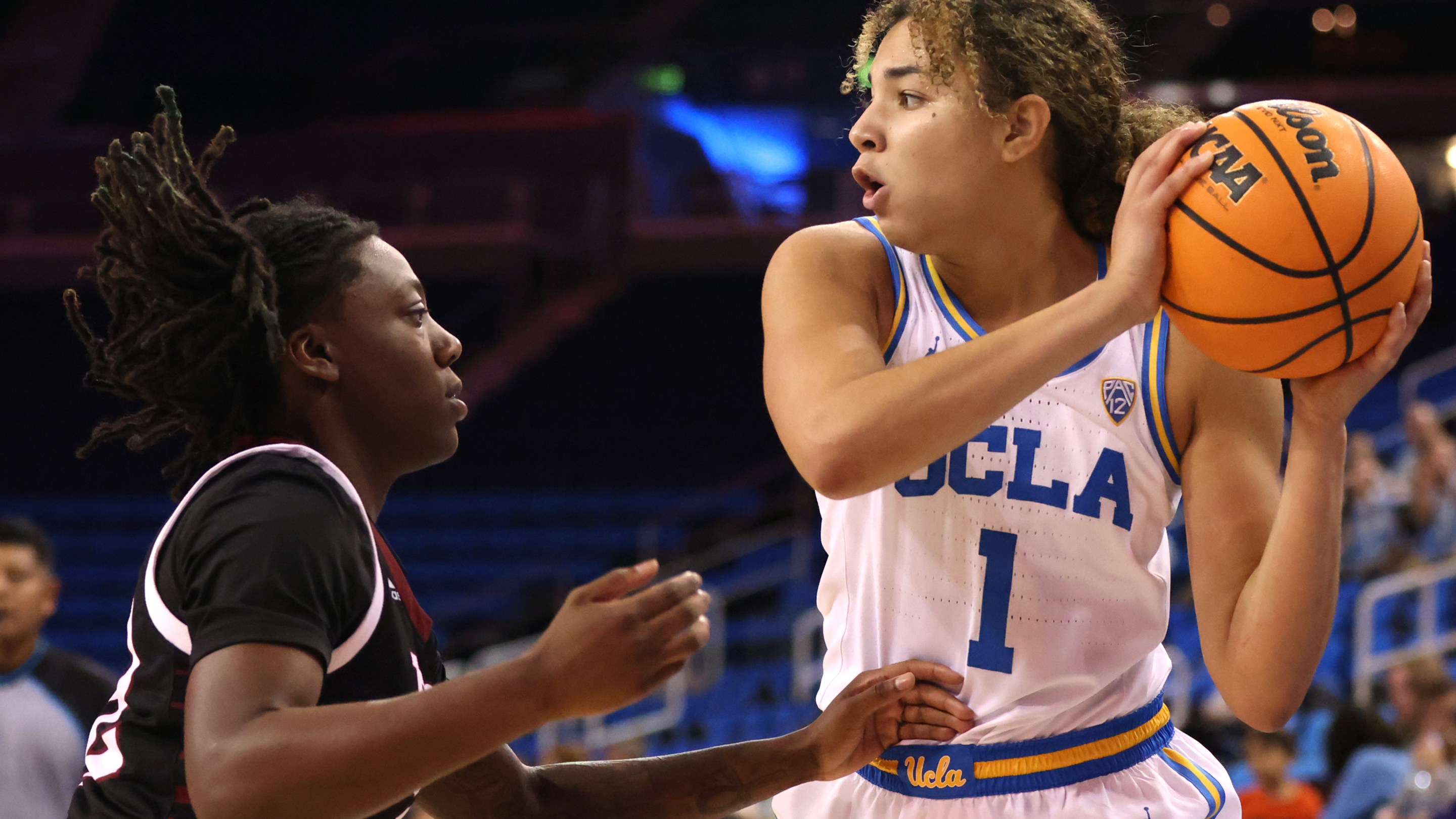 LOS ANGELES, CALIFORNIA - NOVEMBER 13: Kiki Rice #1 of the UCLA Bruins looks to pass during the first half of a game against the Troy Trojans at UCLA Pauley Pavilion on November 13, 2022 in Los Angeles, California.