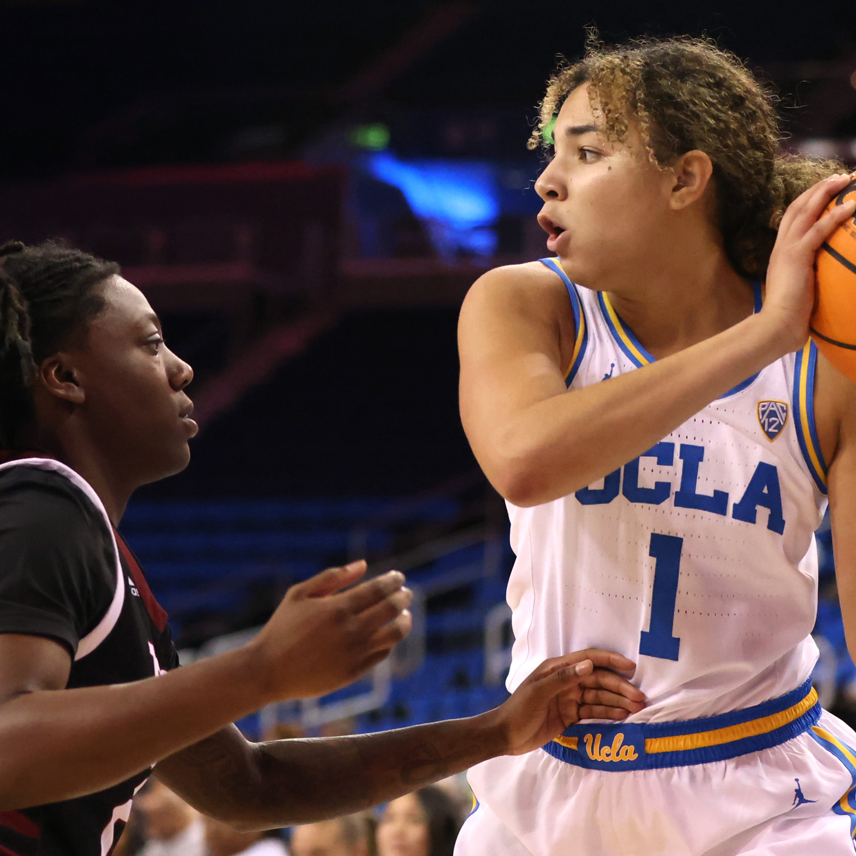 LOS ANGELES, CALIFORNIA - NOVEMBER 13: Kiki Rice #1 of the UCLA Bruins looks to pass during the first half of a game against the Troy Trojans at UCLA Pauley Pavilion on November 13, 2022 in Los Angeles, California.