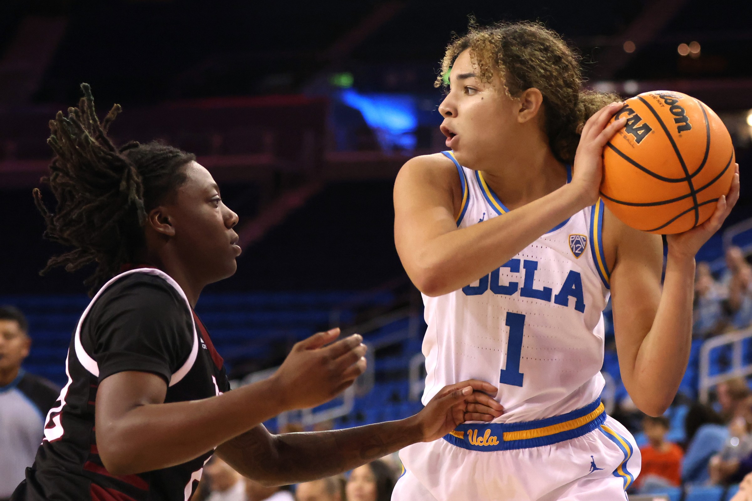LOS ANGELES, CALIFORNIA - NOVEMBER 13: Kiki Rice #1 of the UCLA Bruins looks to pass during the first half of a game against the Troy Trojans at UCLA Pauley Pavilion on November 13, 2022 in Los Angeles, California.