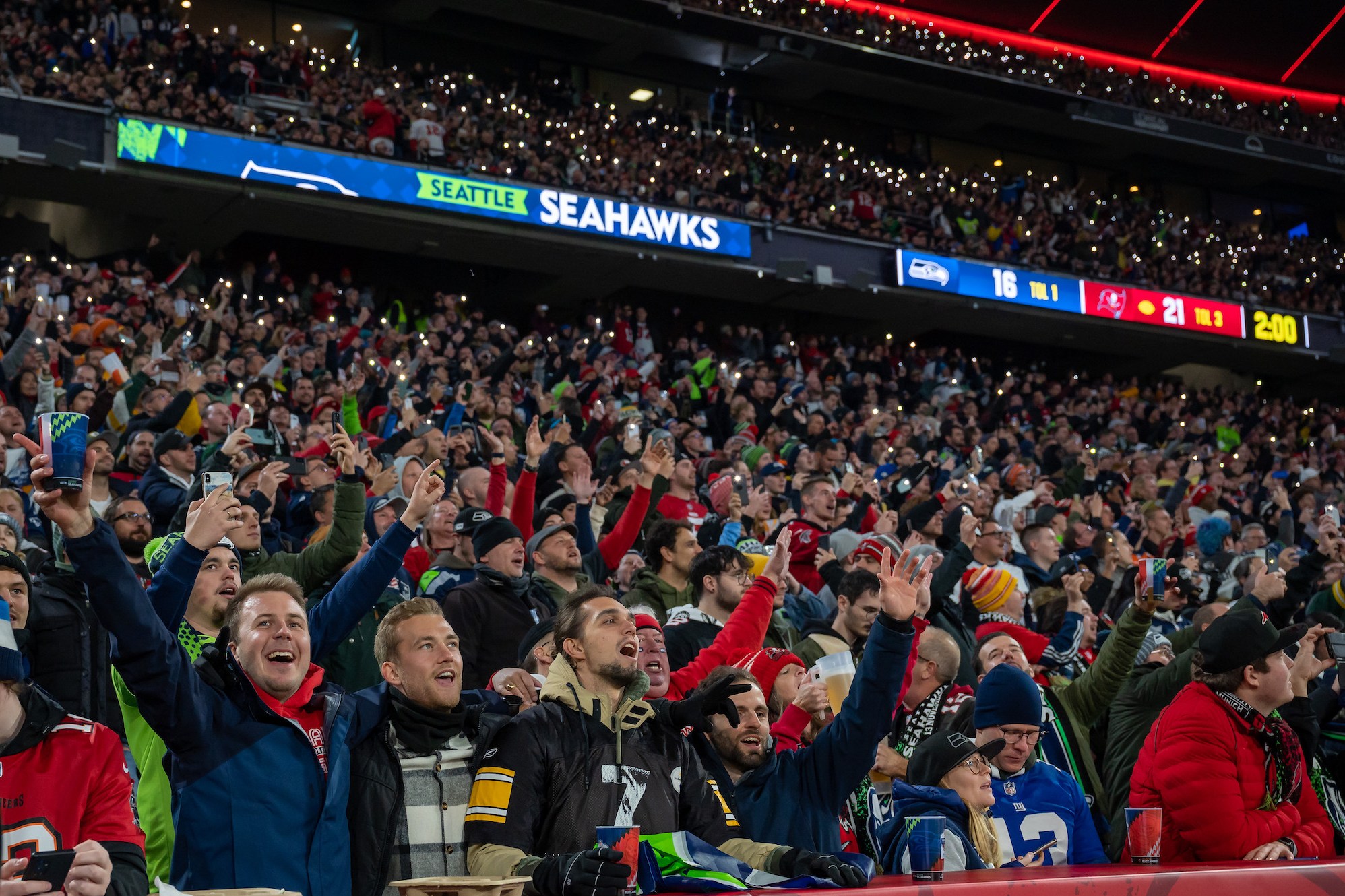 MUNICH, GERMANY - NOVEMBER 13: Fans cheer during the NFL match between Seattle Seahawks and Tampa Bay Buccaneers at Allianz Arena on November 13, 2022 in Munich, Germany. (Photo by Sebastian Widmann/Getty Images)