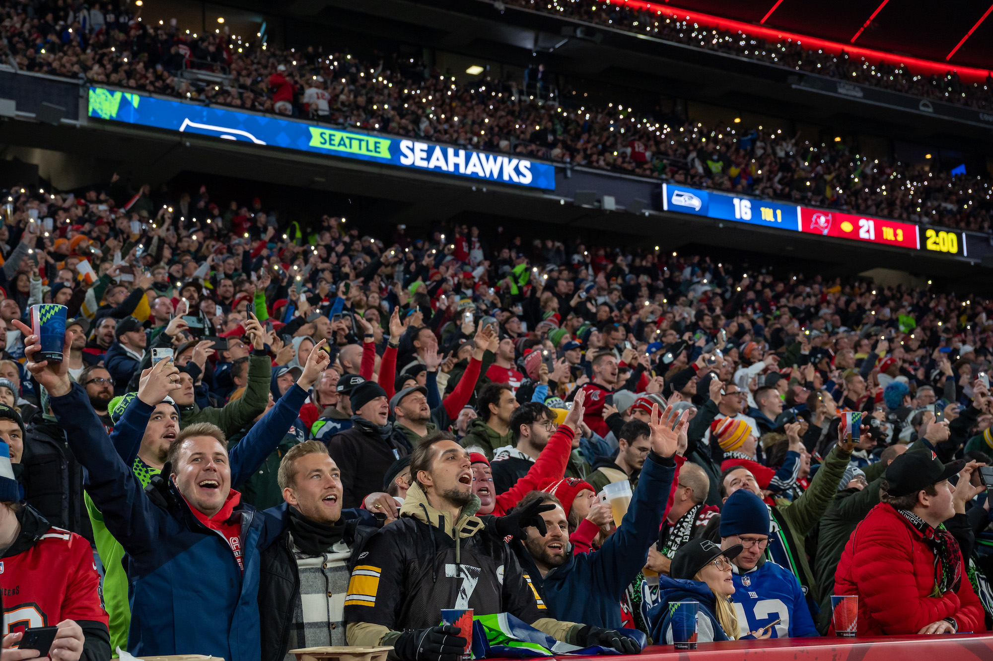 MUNICH, GERMANY - NOVEMBER 13: Fans cheer during the NFL match between Seattle Seahawks and Tampa Bay Buccaneers at Allianz Arena on November 13, 2022 in Munich, Germany. (Photo by Sebastian Widmann/Getty Images)