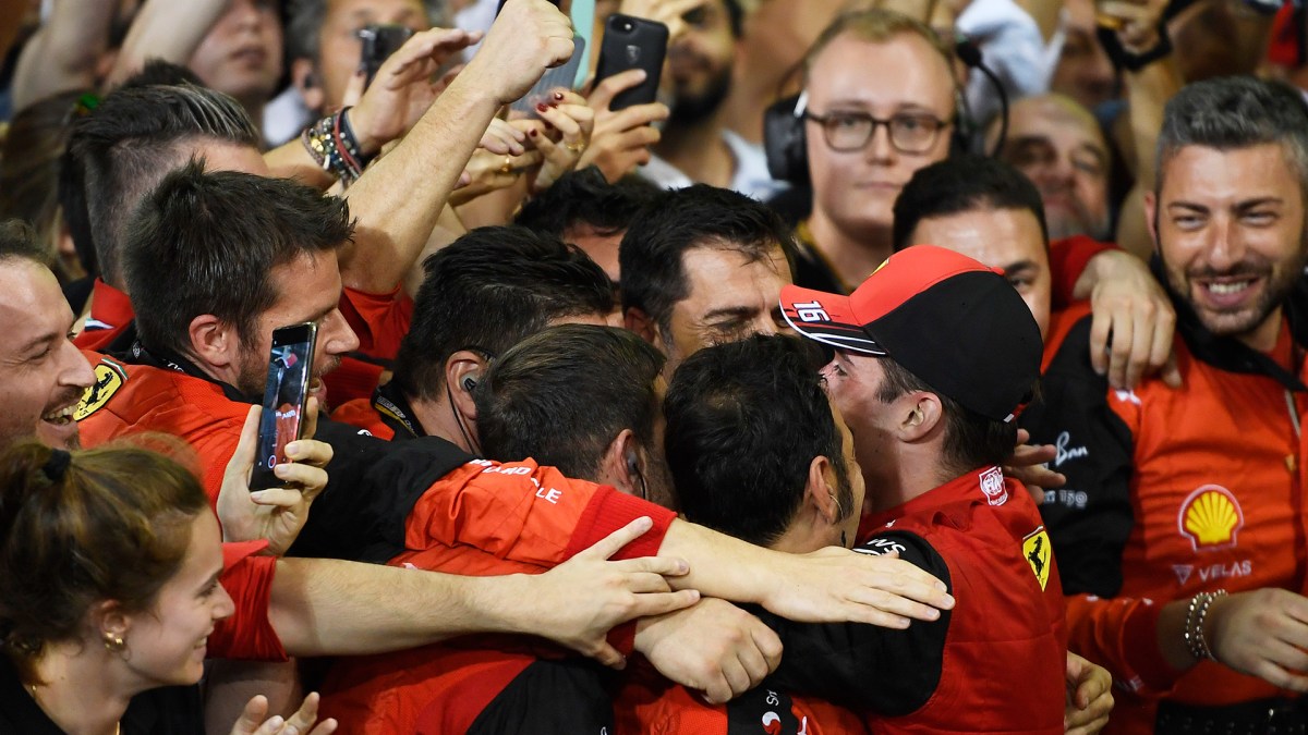 Second placed Charles Leclerc of Monaco and Ferrari celebrates with teammates following the F1 Grand Prix of Abu Dhabi at Yas Marina Circuit on November 20, 2022 in Abu Dhabi, United Arab Emirates.