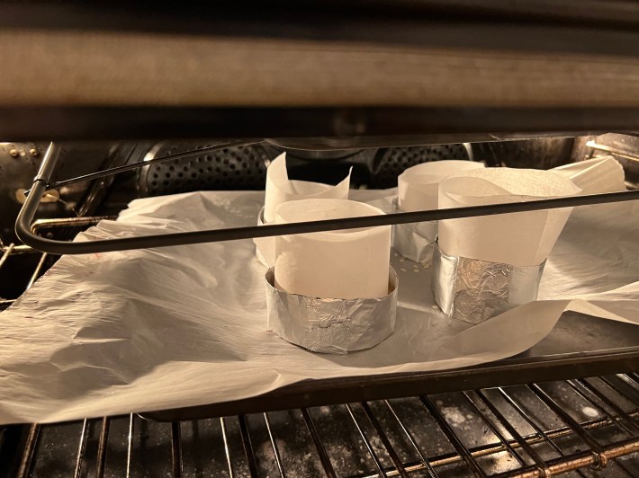 Foil-lined rice-filled pastries go into the oven.