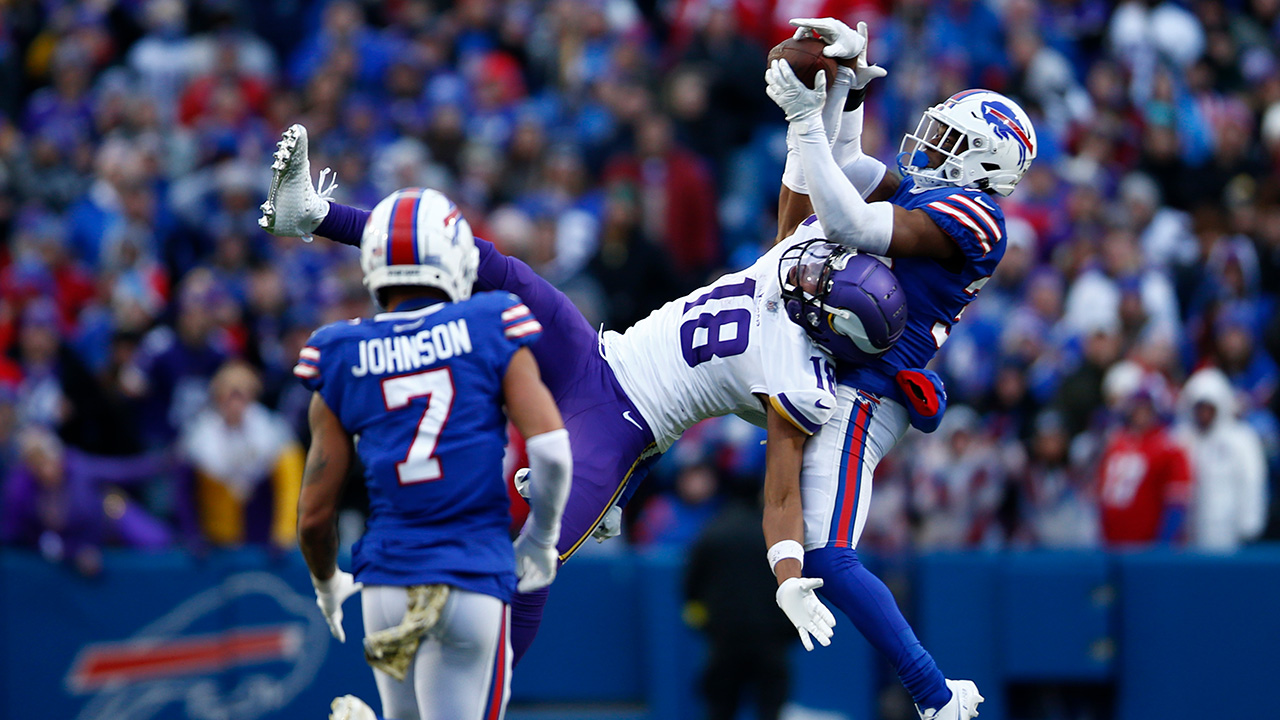 ORCHARD PARK, NEW YORK - NOVEMBER 13: Justin Jefferson #18 of the Minnesota Vikings catches a pass in front of Cam Lewis #39 of the Buffalo Bills during the fourth quarter at Highmark Stadium on November 13, 2022 in Orchard Park, New York.