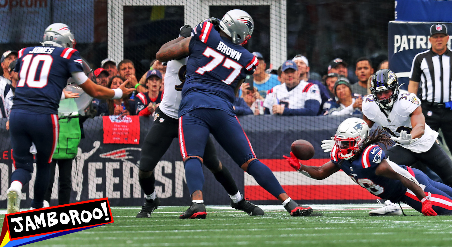 Foxborough, MA - September 25: New England Patriots running back Rhamondre Stevenson attempted to lateral the ball to QB Mac Jones on a two-point conversion attempt, but the try was ruled unsuccessful after a booth review. The Patriots lost to the Baltimore Ravens, 37-26. (Photo by Jim Davis/The Boston Globe via Getty Images)