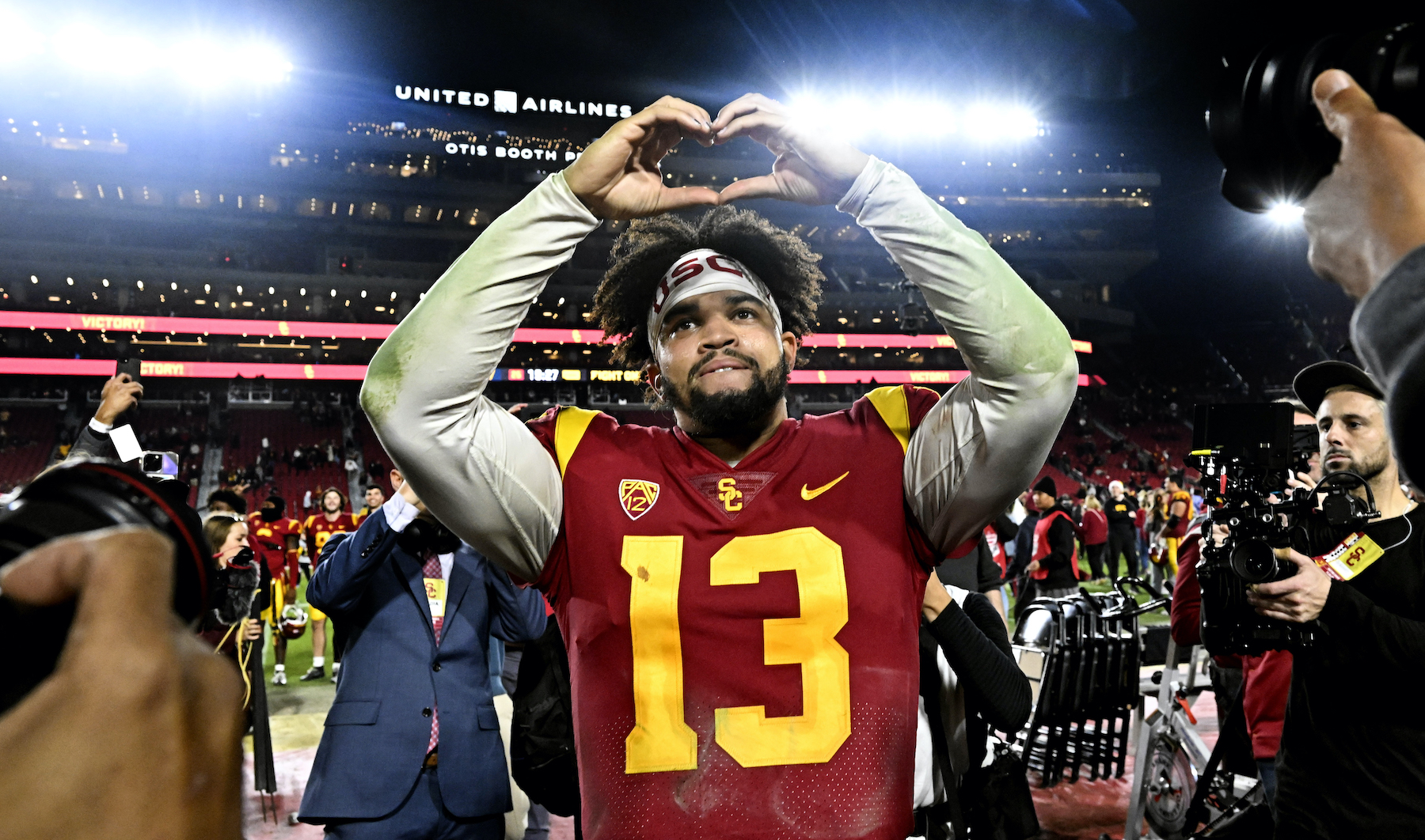 Quarterback Caleb Williams #13 of the USC Trojans celebrates USC Trojans defeated the Notre Dame Fighting Irish 38-27 during a NCAA football game at the Los Angeles Memorial Coliseum in Los Angeles on Saturday, November 26, 2022.
