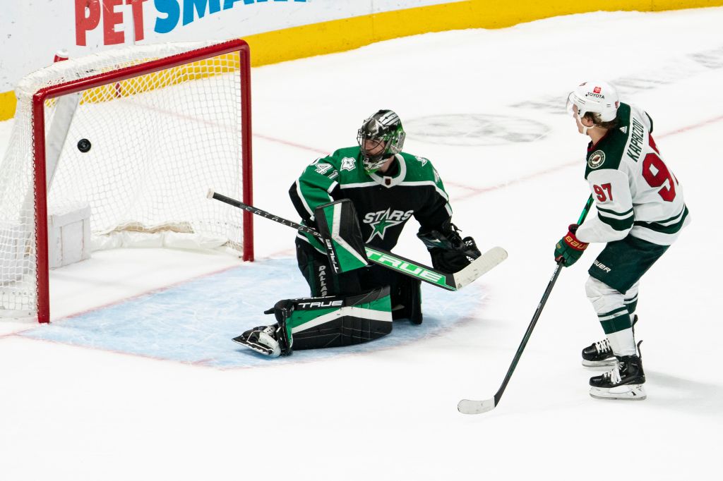 Kirill Kaprizov makes a shot over Scott Wedgewood in the shootout