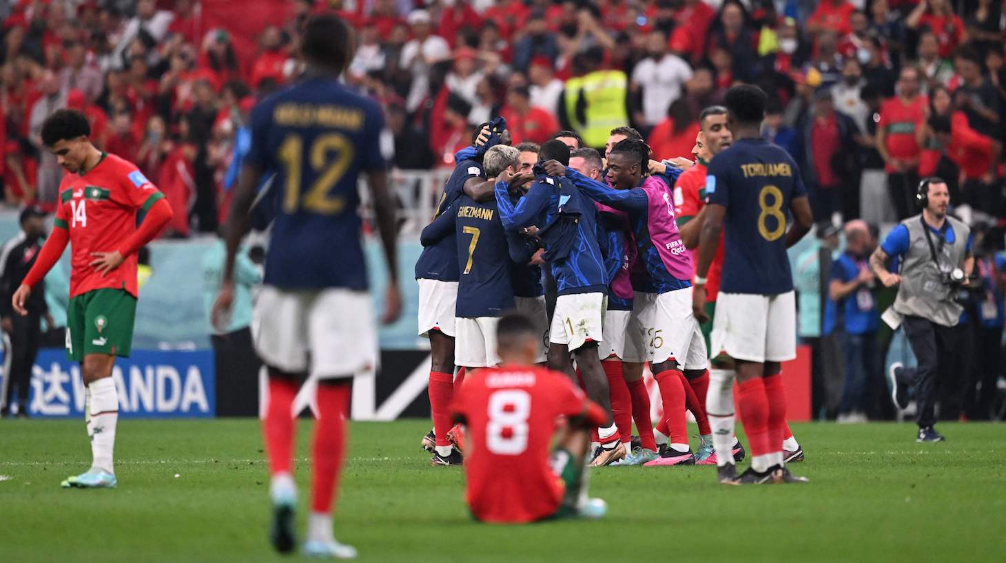 France's players celebrate their victory in the Qatar 2022 World Cup semi-final football match between France and Morocco at the Al-Bayt Stadium in Al Khor, north of Doha on December 14, 2022.
