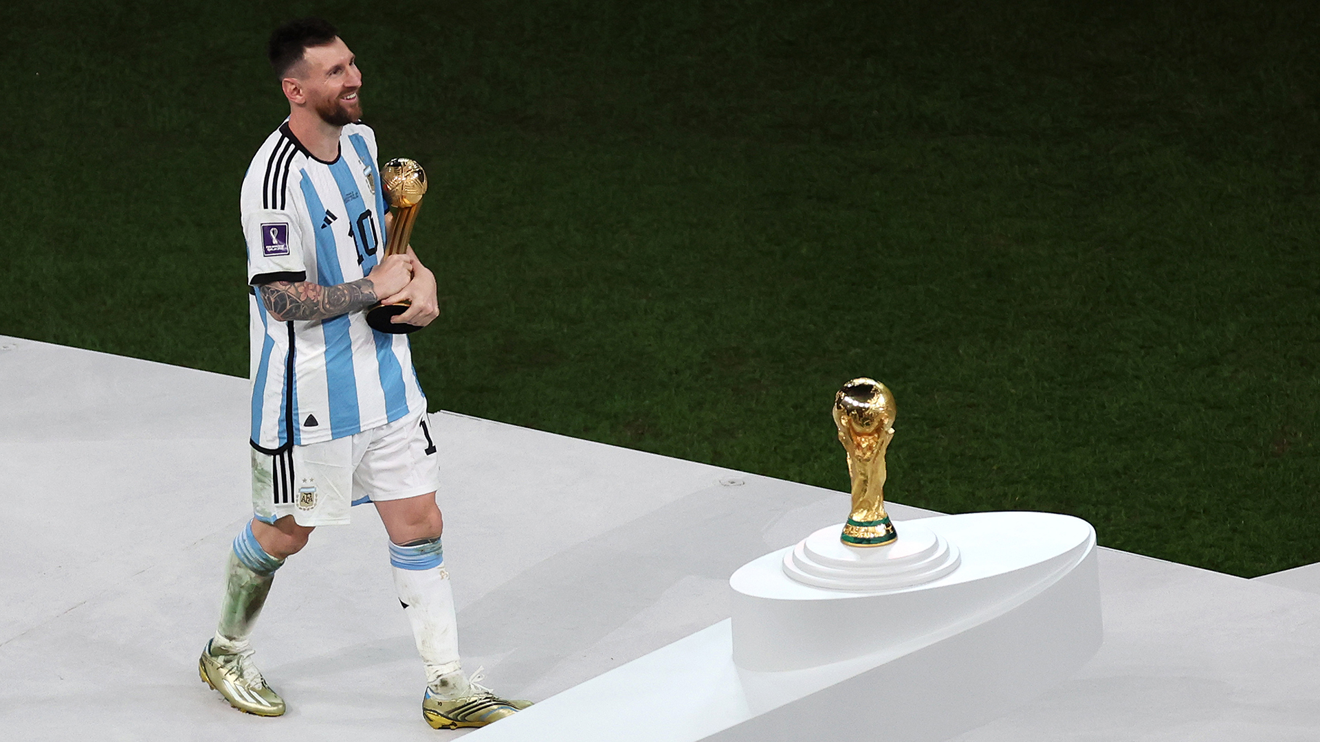 Lionel Messi of Argentina poses with his Golden ball award following the FIFA World Cup Qatar 2022 Final match between Argentina and France at Lusail Stadium on December 18, 2022 in Lusail City, Qatar.