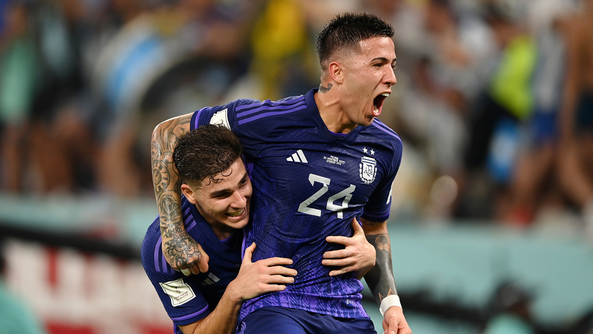 Julian Alvarez of Argentina celebrates with Enzo Fernandez after scoring their team's second goal during the FIFA World Cup Qatar 2022 Group C match between Poland and Argentina at Stadium 974 on November 30, 2022 in Doha, Qatar.