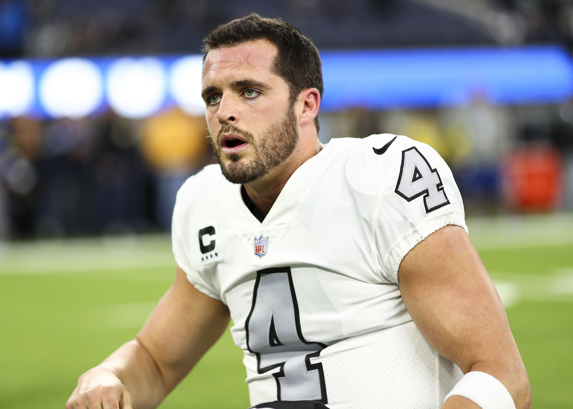 INGLEWOOD, CA - DECEMBER 8: Derek Carr #4 of the Las Vegas Raiders yells to teammates while stretching prior to an NFL football game against the Los Angeles Rams at SoFi Stadium on December 8, 2022 in Inglewood, California. (Photo by Kevin Sabitus/Getty Images)