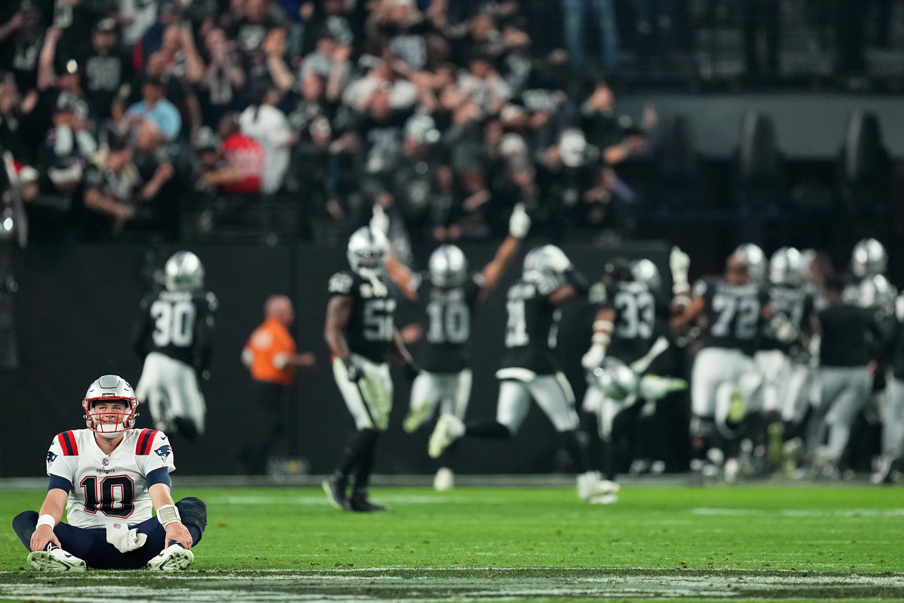 LAS VEGAS, NEVADA - DECEMBER 18: Mac Jones #10 of the New England Patriots reacts after losing to the Las Vegas Raiders at Allegiant Stadium on December 18, 2022 in Las Vegas, Nevada. (Photo by Chris Unger/Getty Images)