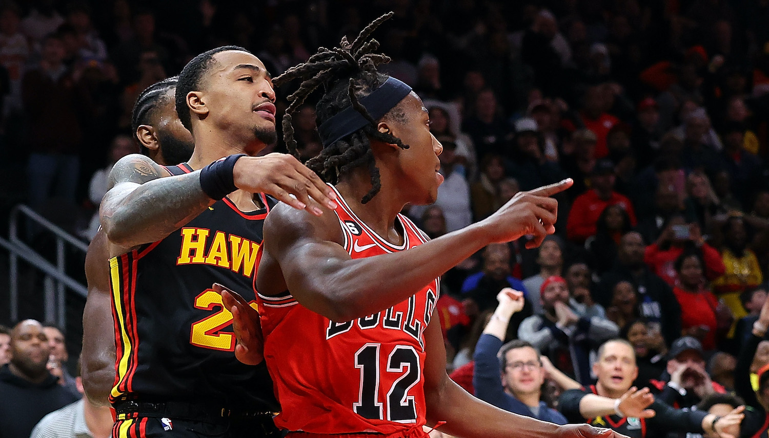 Ayo Dosunmu #12 of the Chicago Bulls reacts as he scores the game-winning basket as time expires in their 110-108 win over the Atlanta Hawks at State Farm Arena on December 21, 2022 in Atlanta, Georgia. NOTE TO USER: User expressly acknowledges and agrees that, by downloading and or using this photograph, User is consenting to the terms and conditions of the Getty Images License Agreement.