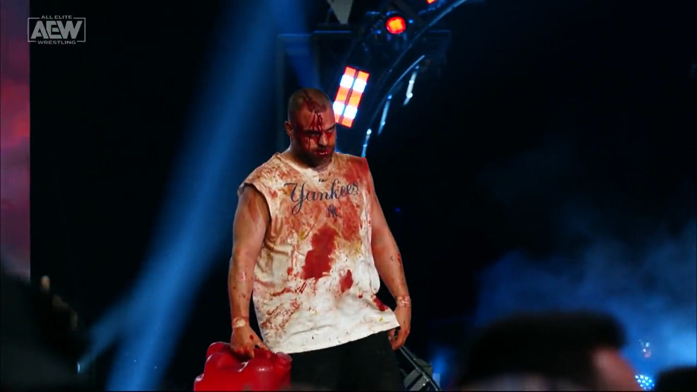 A bloodied Eddie Kingston with a can of gasoline