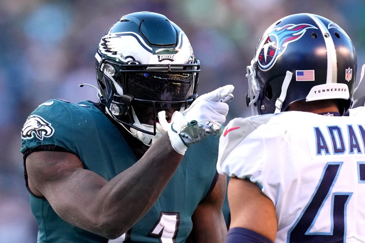 PHILADELPHIA, PENNSYLVANIA - DECEMBER 04: A.J. Brown #11 of the Philadelphia Eagles points in the face of Andrew Adams #47 of the Tennessee Titans in the fourth quarter at Lincoln Financial Field on December 04, 2022 in Philadelphia, Pennsylvania.